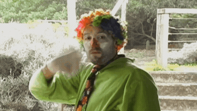 Man Dressed As Clown In Green Jacket GIF