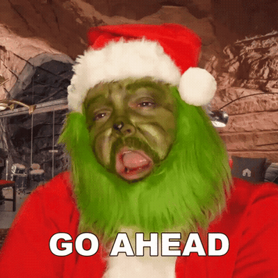Man Dressed As Grinch Saying Go Ahead GIF