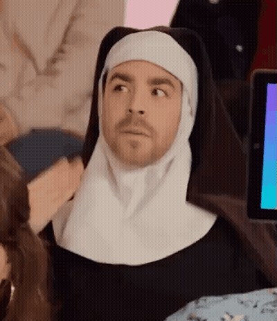 Man Dressed As Nun Sitting At Computer GIF