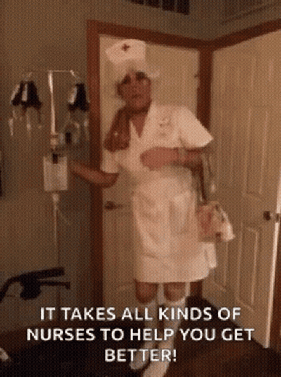 Man Dressed As Nurse Holding Bag GIF