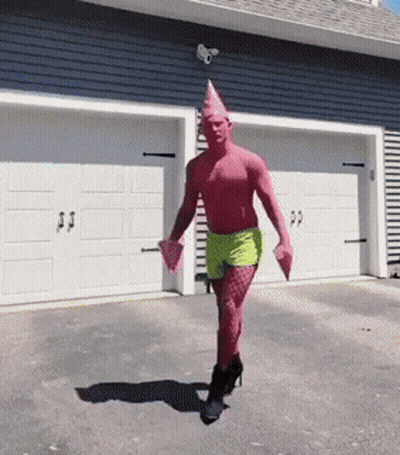 Man Dressed As Patrick Star Walking In Front Of Garage GIF