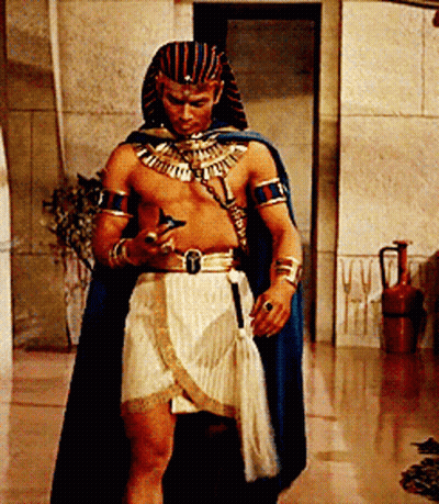 Man Dressed As Pharaoh Looking At Cell Phone GIF