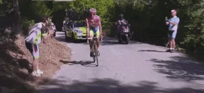 Man Dressed As Roman Soldier In Dark Room GIF