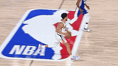 Man Dribbling Basketball In Front Of NBA Logo GIF