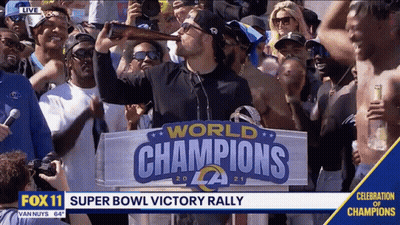 Man Drinking Beer In Front Of World Champions Sign GIF