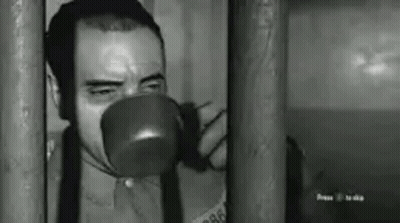 Man Drinking Behind Bars GIF