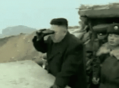 Man Drinking Bottle Next To Soldiers GIF