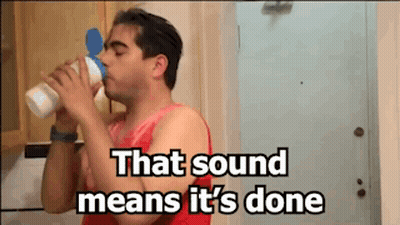 Man Drinking Bottle Saying That Sound Means It's Done GIF