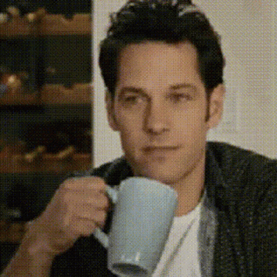 Man Drinking Coffee Looking At Camera GIF