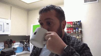Man Drinking From Apple Logo Cup GIF