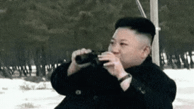 Man Drinking From Bottle In Snow GIF