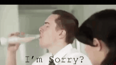 Man Drinking From Bottle While Woman Says I'm Sorry GIF