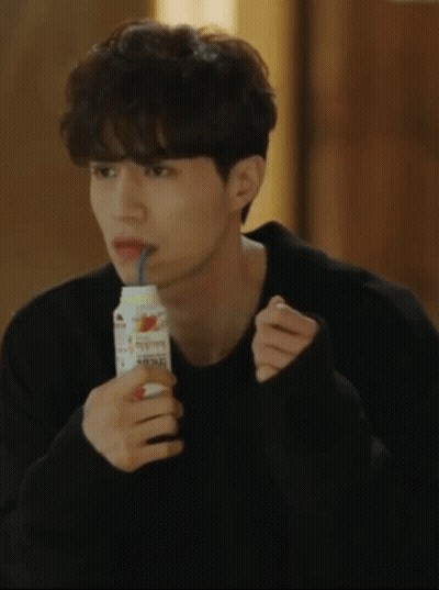 Man Drinking From Bottle With Straw GIF