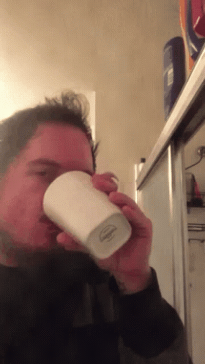Man Drinking From Cup Saying Johnson GIF