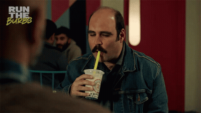 Man Drinking From Cup With Yellow Straw GIF