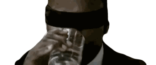 Man Drinking From Glass With Blindfold Sticker