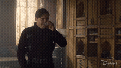 Man Drinking From Glass With Disney Logo GIF