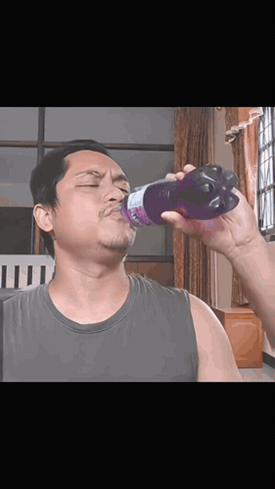 Man Drinking From Purple Strawberry Bottle GIF