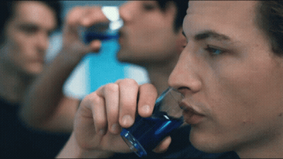 Man Drinking From Shot Glass With Blue Liquid GIF