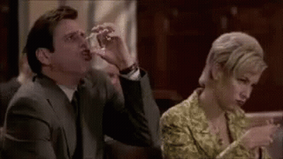 Man Drinking From Star Wars Mug In Front Of Storm Trooper Helmet GIF