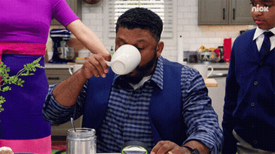 Man Drinking From White Cup With Nick Logo GIF
