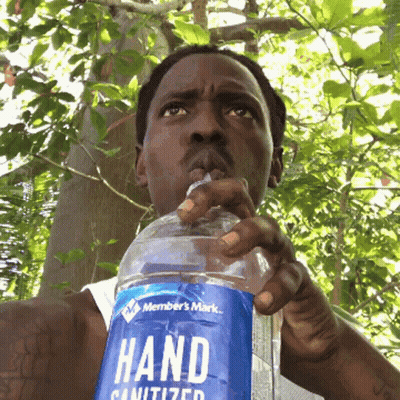 Man Drinking Hand Sanitizer Bottle GIF
