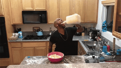 Man Drinking Milk From Gallon Bottle
