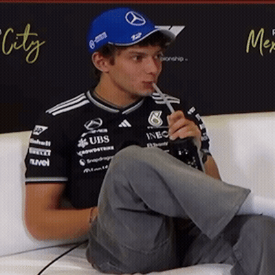 Man Drinking Through Straw In Mercedes Hat GIF