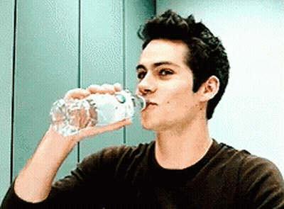 Man Drinking Water From Bottle With Letter O GIF