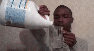 Man Drinking Water From Gallon Holding Glass GIF