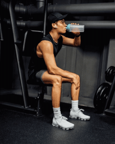 Man Drinking Water On Bench GIF