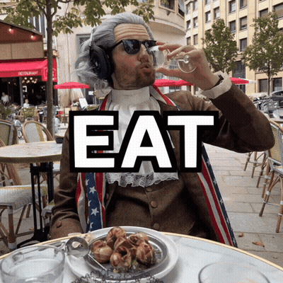Man Drinking Wine In Front Of Eat Sign GIF