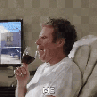 Man Drinking Wine While Sitting in Chair