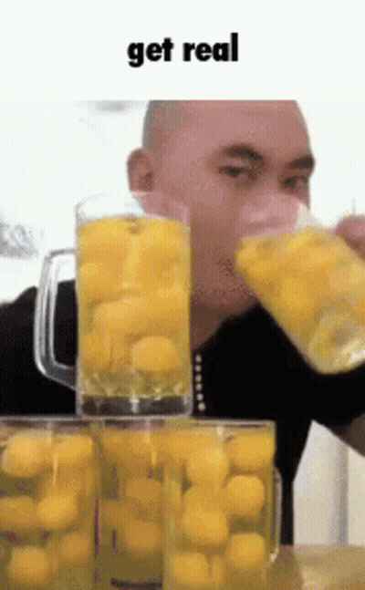 Man Drinking Yellow Balls Saying Get Real GIF