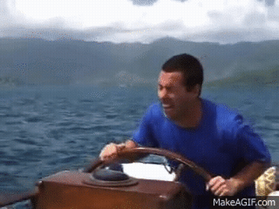 Man Driving Boat In Ocean GIF