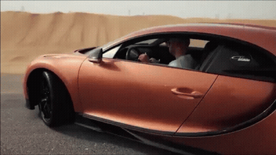 Man Driving Bugatti Chiron On Desert Road GIF