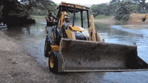 Man Driving Bulldozer In Water GIF