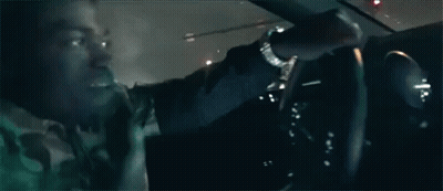 Man Driving Car At Night With Another Looking On GIF