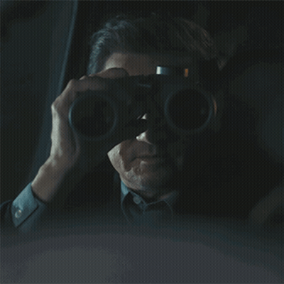 Man Driving Car In Dark Looking Out Window GIF