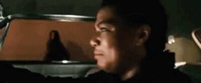 Man Driving Car Looking Out Window GIF