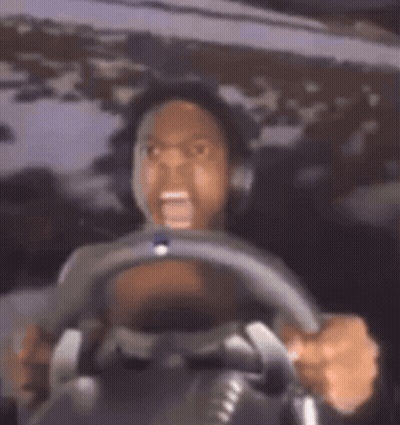 Man Driving Car With Mouth Open