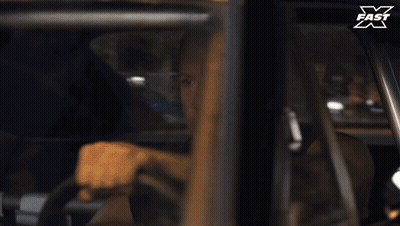Man Driving Car With X Fast Logo GIF