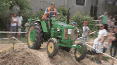 Man Driving Green Tractor Number 6 GIF