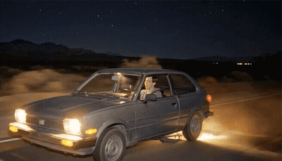 Man Driving Honda On Desert Road At Night GIF