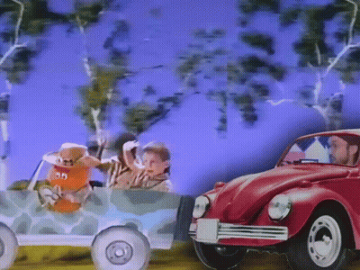 Man Driving Red Car Next To Toy Car 30 GIF