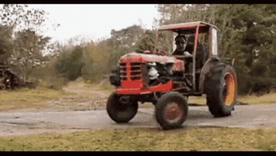 Man Driving Red Tractor GIF