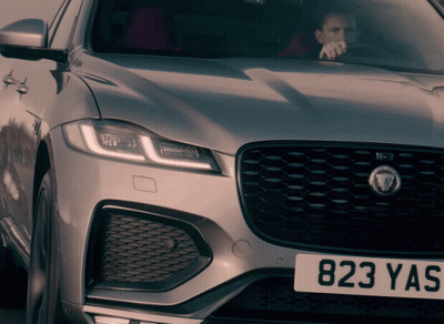 Man Driving Silver Jaguar With 823 Yas GIF
