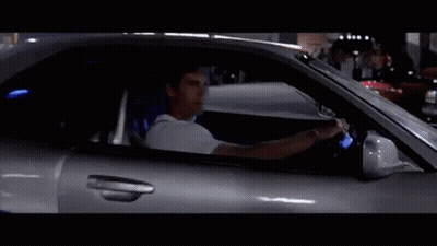 Man Driving Silver Sports Car With Blue Seat Belt GIF