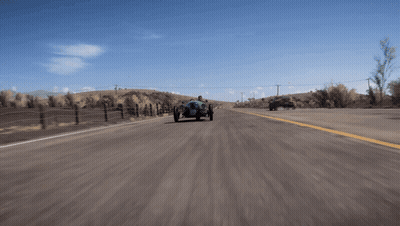 Man Driving Three-Wheeled Vehicle On Desert Road GIF