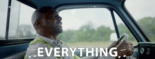 Man Driving Truck With Everything Text GIF